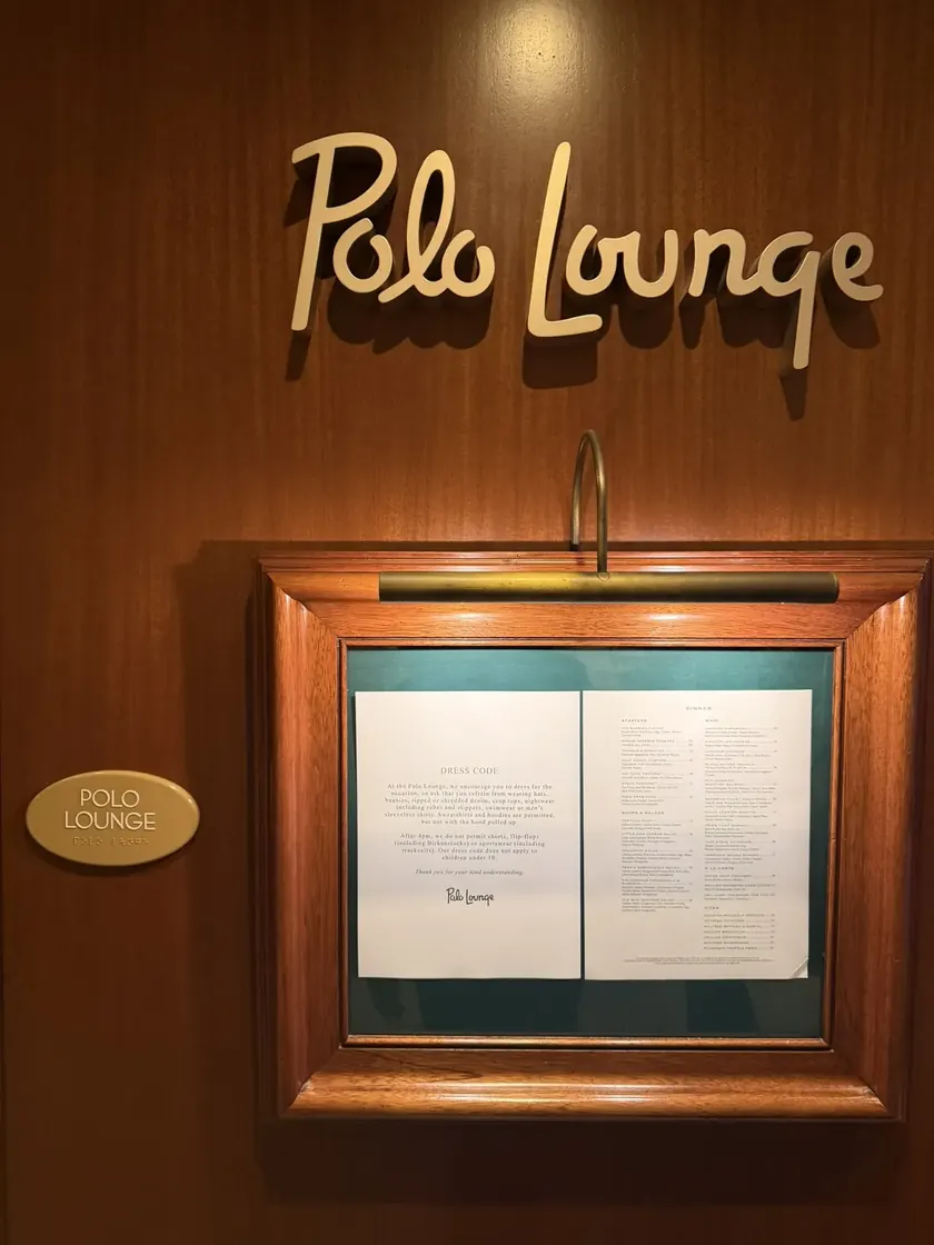 Classic gold lettering at the entrance of a historic lounge